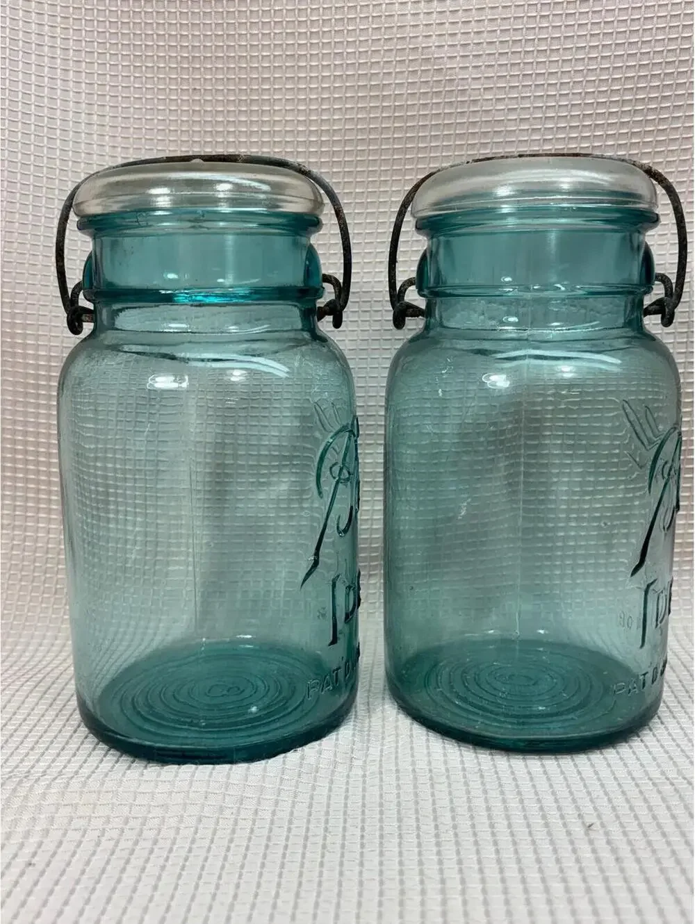 62 - 2 vintage round Blue canning jars wire lock glass lids -  Ball